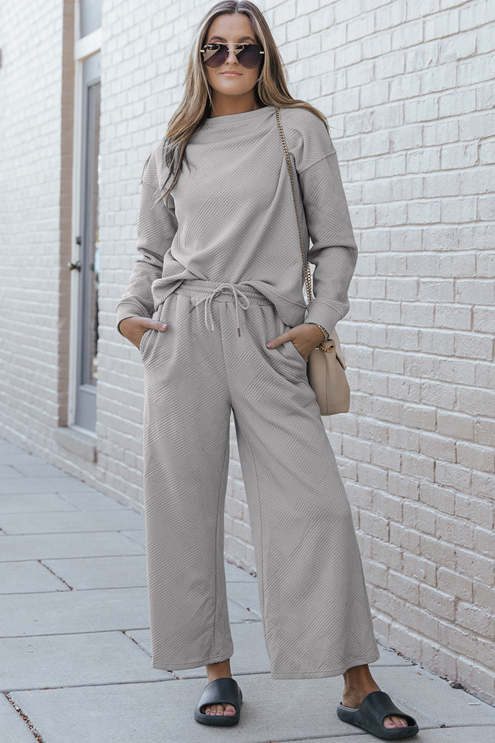 Koisoon Full Size Textured Long Sleeve Top and Drawstring Pants Set